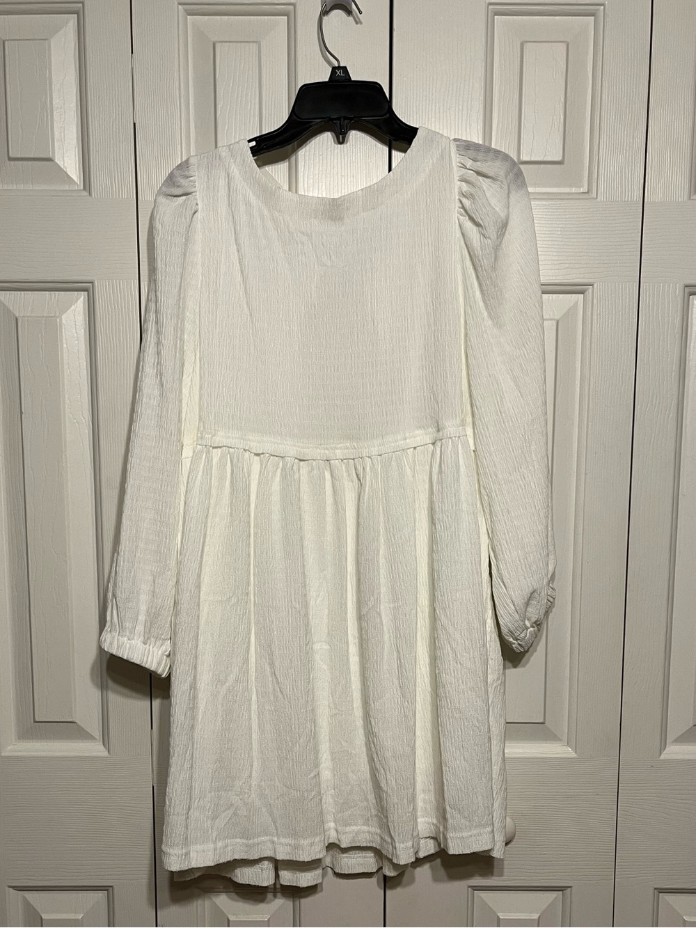 White long sleeve mini dress.  Large.  pHas pockets.